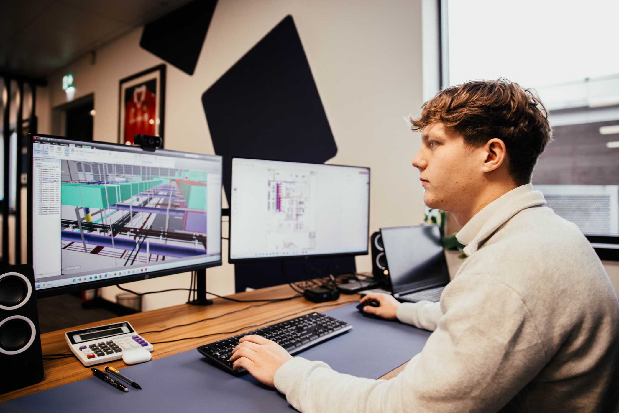 Technical drawings at a desk